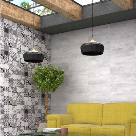 Living room feature wall tiled horizontally in Keywood Blanco Ceramic Tiles behind a yellow sofa.