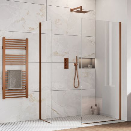 Oxford Brushed Bronze Walk-In Wetroom Shower Screen with clear glass panels and bronze trim profile in a modern marble effect tiled bathroom.