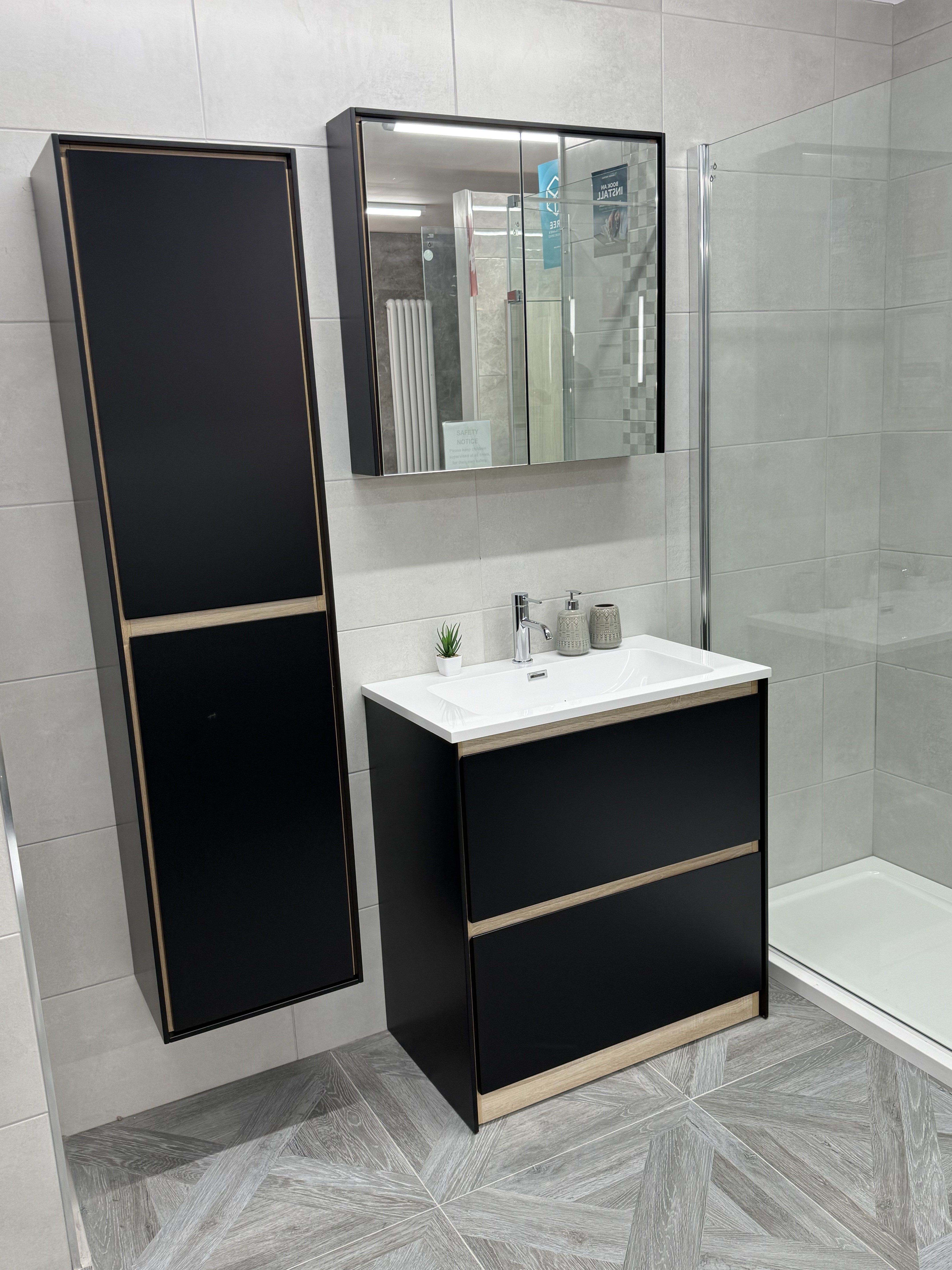 Newbury bathroom furniture display in Matt Black and Sawn Oak with an 800mm vanity unit, mirror and matching tall cabinet at the Romford showroom.