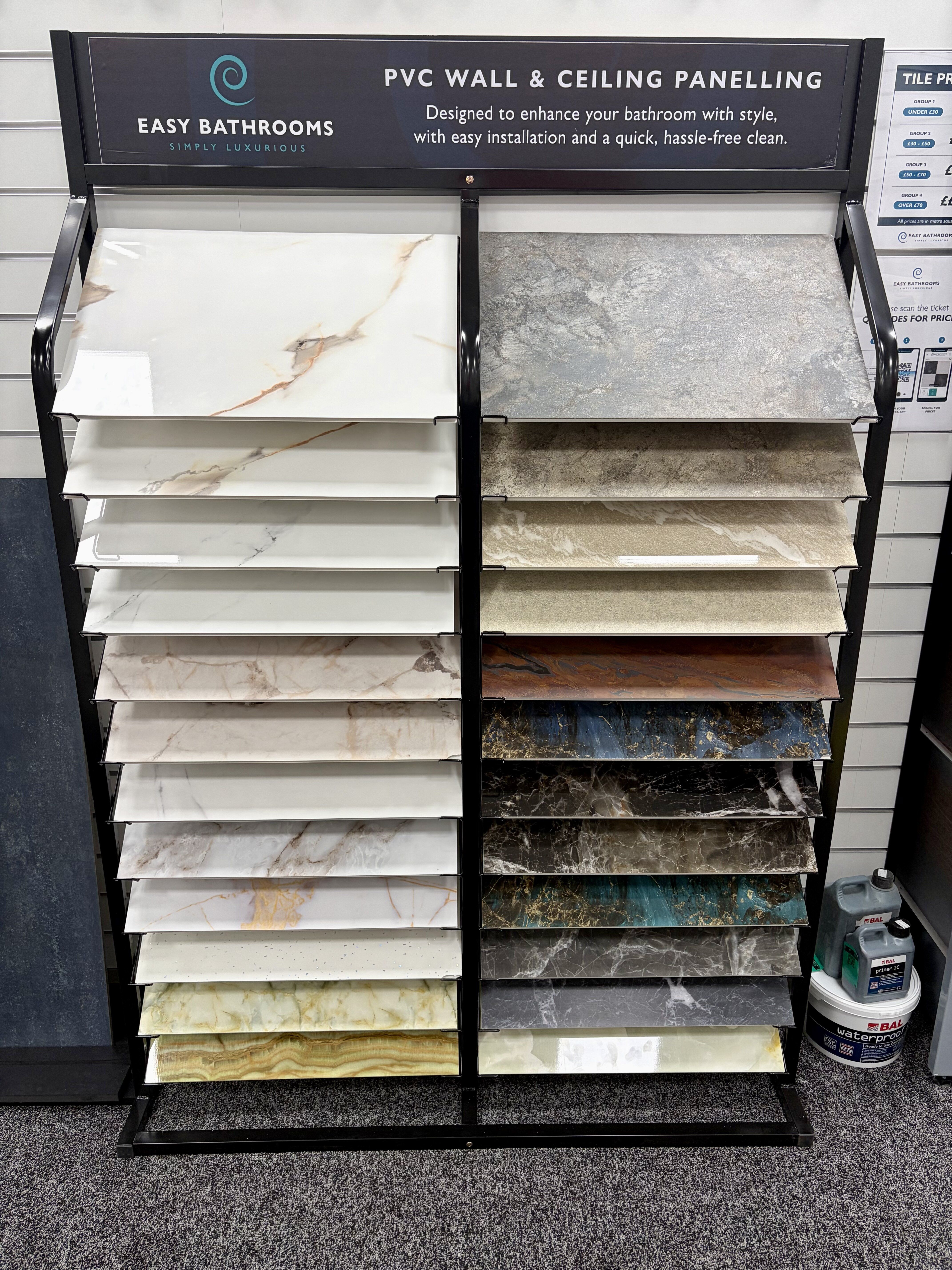 Pristina PVC wall panel sample display at Easy Bathrooms Nottingham Castle showing a wide range of marble, stone and decorative finishes.
