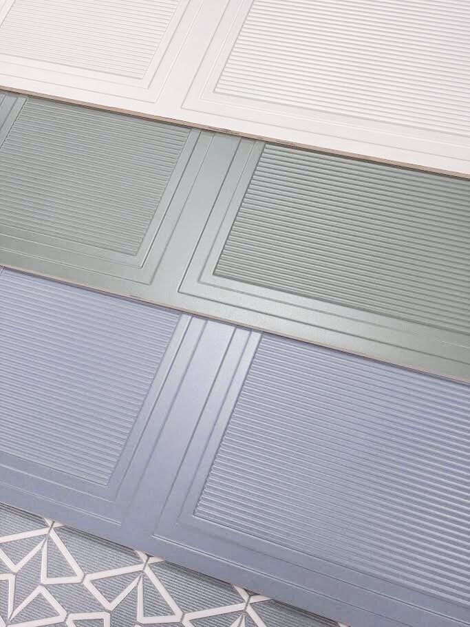 1. Close-up of Huntsman fluted panel-effect and decorative ceramic tile samples at Easy Bathrooms Bedford.