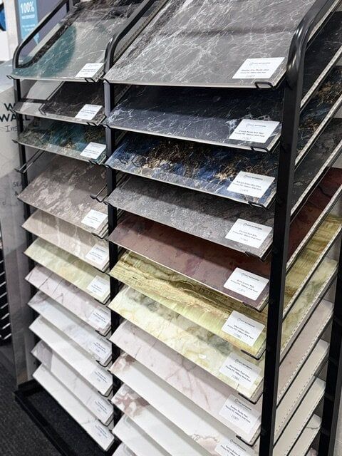 New bathroom wall panel sample display featuring a range of finishes at Easy Bathrooms Chelmsford.