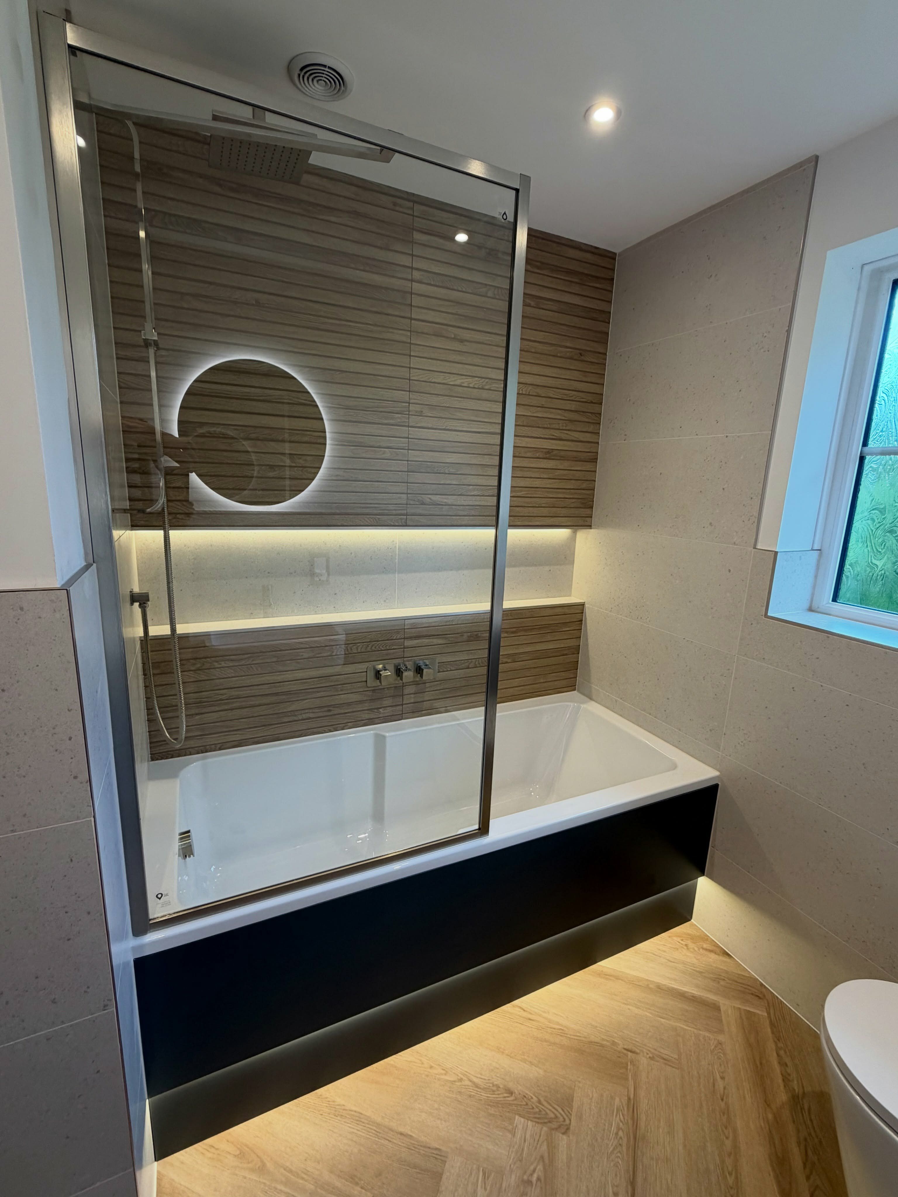 Completed Norwich bathroom renovation with walk-in shower, Dune 4D Wood Panel tiles and built-in shower storage.