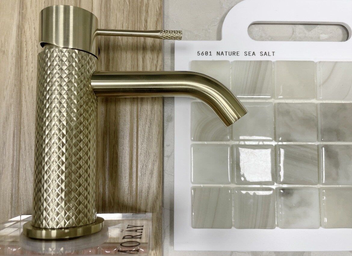 Bathroom mood board featuring natural oak finishes, glossy rose tiles and coordinating neutral samples.