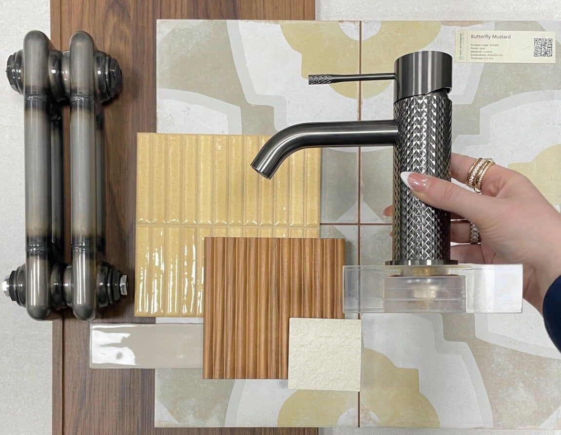 Bathroom mood board with warm neutral tiles, wood-effect finishes and black bathroom brassware.