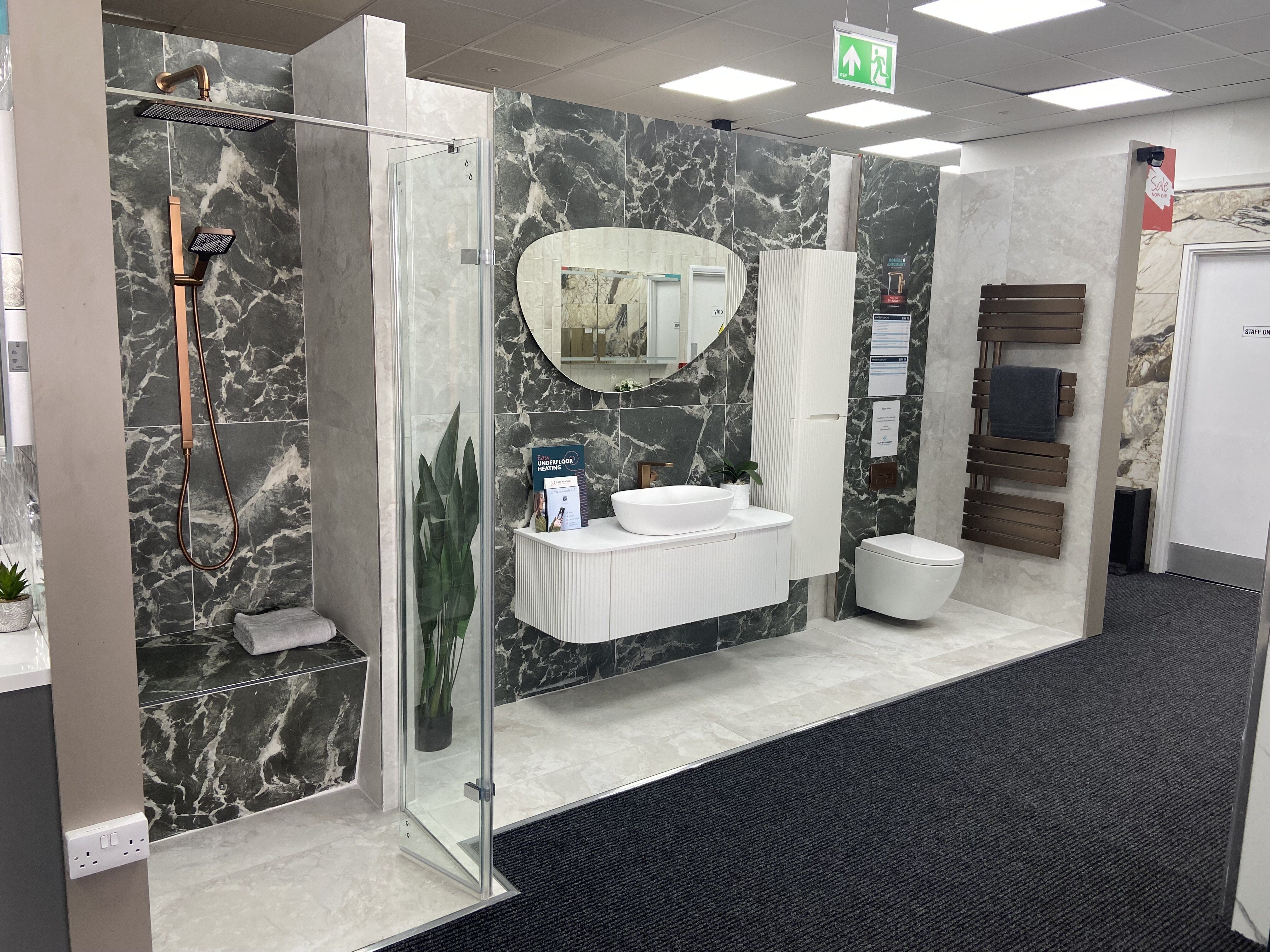 Refurbished Easy Bathrooms Newbury showroom featuring new bathroom displays and updated lighting.