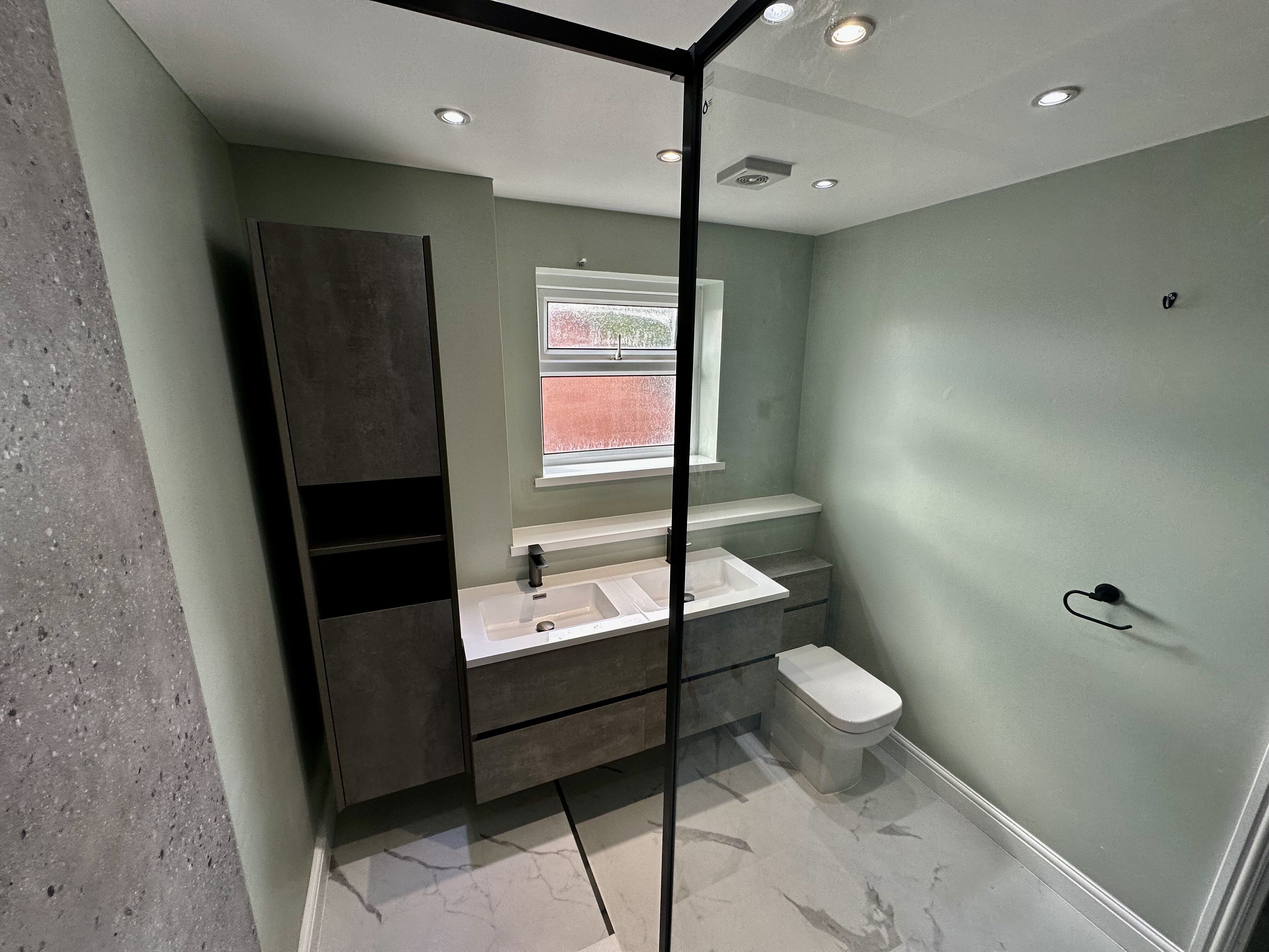 Modern walk in shower in a sage green bathroom created by Easy Bathrooms Lincoln