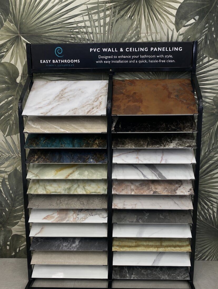 Pristina PVC bathroom wall panel sample display at Easy Bathrooms Orpington featuring marble, stone and onyx-effect finishes.