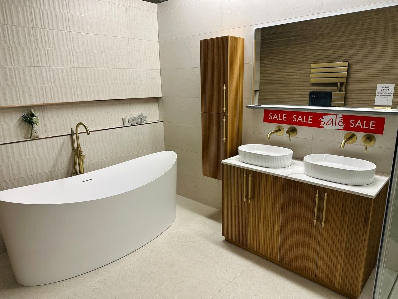 Prospera freestanding bath featured in showroom display of bathroom furniture