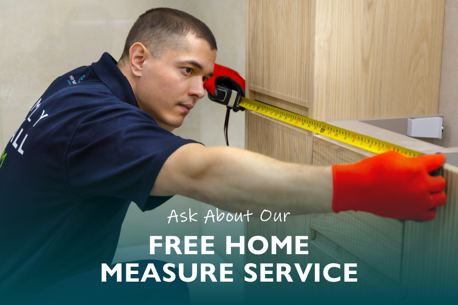Easy Bathrooms showroom team member measuring a bathroom as part of the free home measure service.