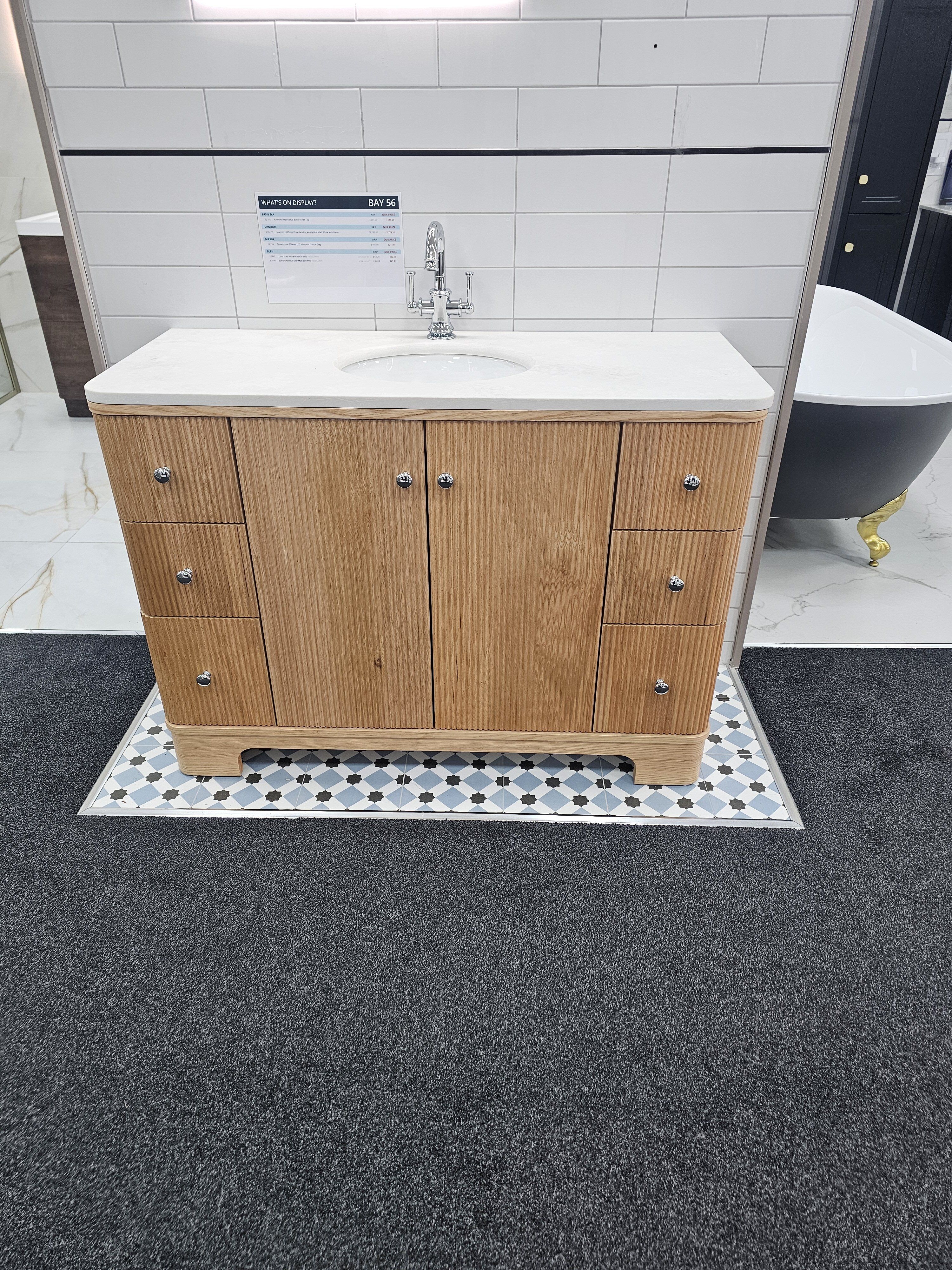 Showroom display featuring wooden bathroom vanity unit