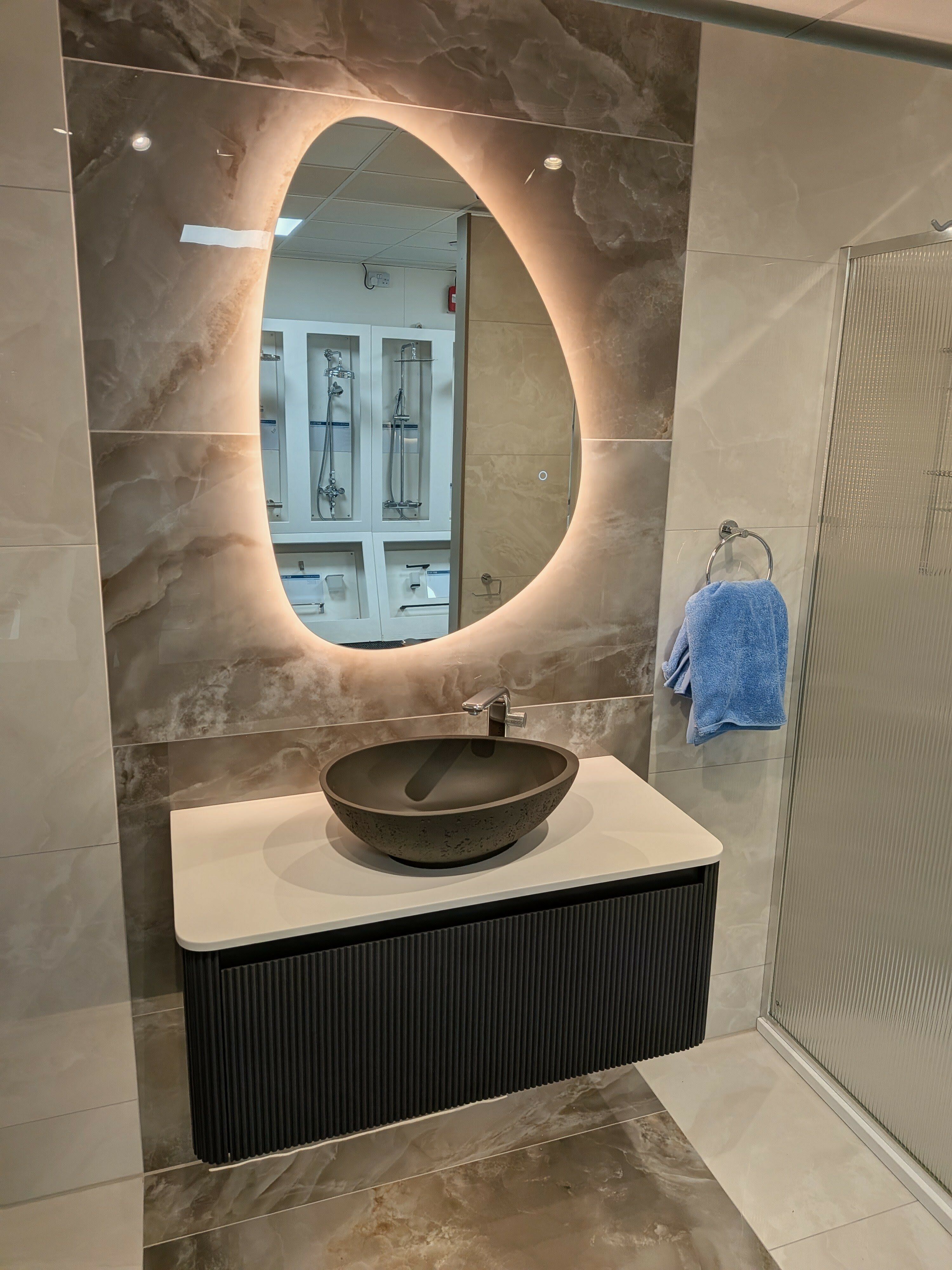 Modern concrete countertop sink with LED mirror at Easy Bathrooms Rayleigh