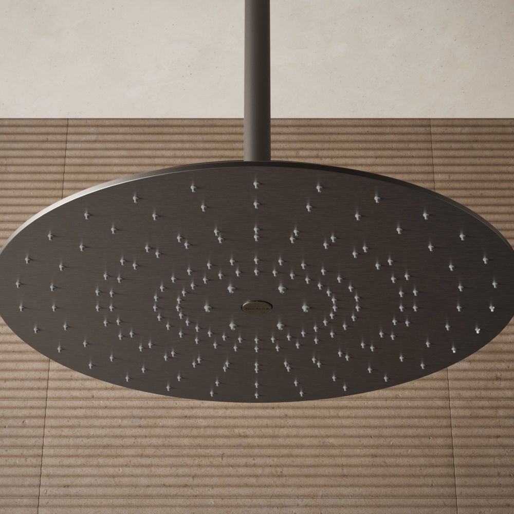 Aqualisa S3 gunmetal shower head on an brown tiled background