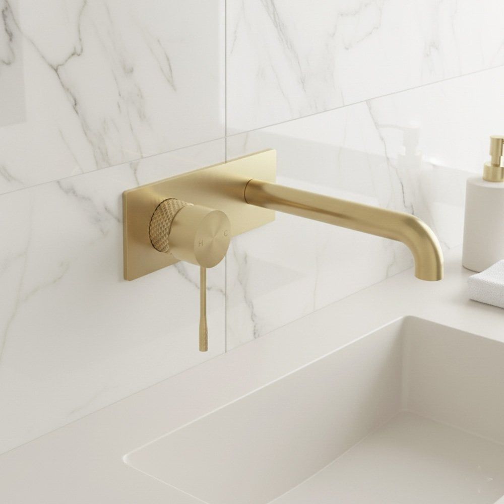 Moray Brushed Gold wall mounted basin tap featuring a textured knurled detailing - Roomset