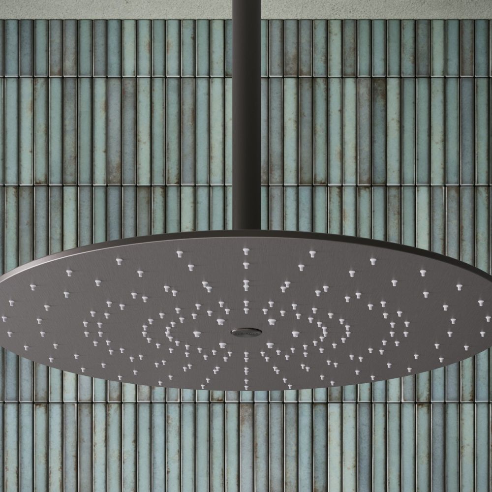 Aqualisa S3 gunmetal shower head on an aqua tiled background