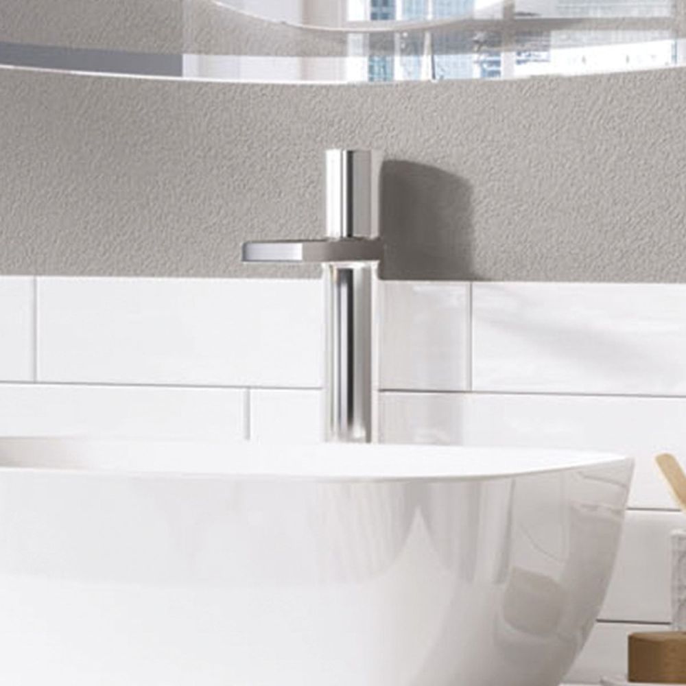 Lifestyle image in a neutral cool bathroom showing the Pancho Chrome Tall Basin Mixer Tap