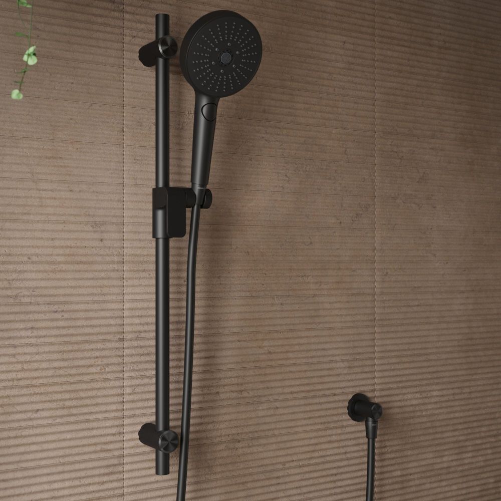 Aqualisa S3 black Slide Rail Kit detailed view upon a brown tiled background