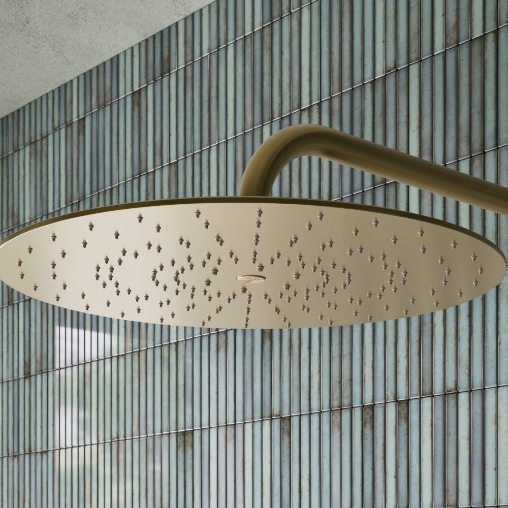 Aqualisa S3 Gold Wall Fixed Shower Head detailed view upon a teal tiled background