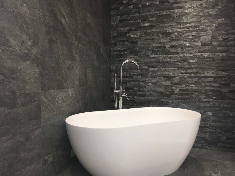 Dark Brick Tile Styled With Freestanding Bath