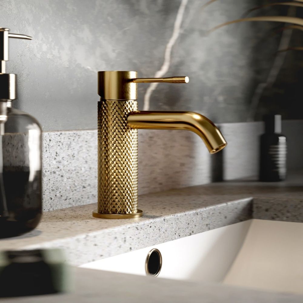 Moray Brushed Gold single lever basin mixer tap featuring a textured knurled detailing - Roomset