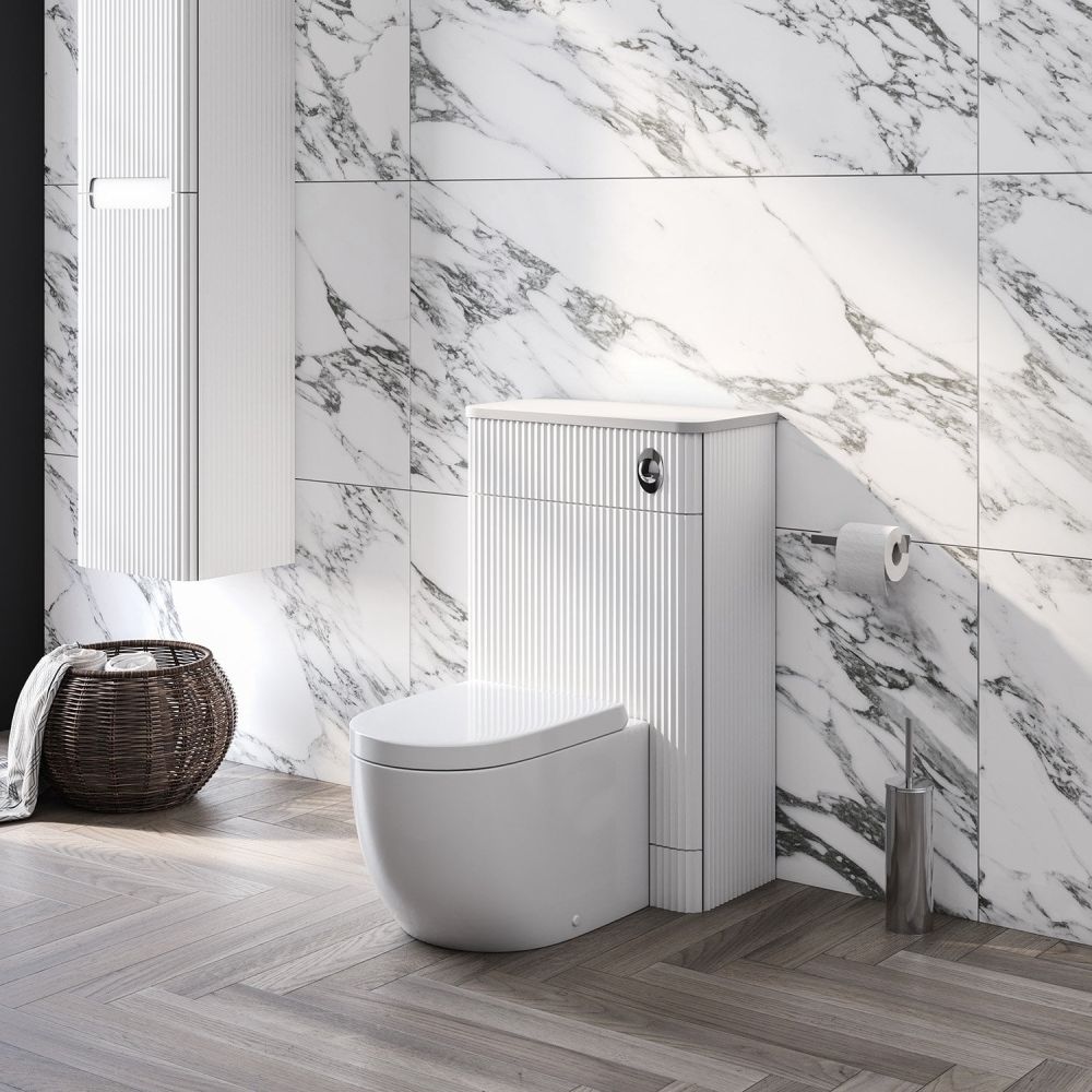 white marble roomset showcasing the Soar Ribbed White WC Unit