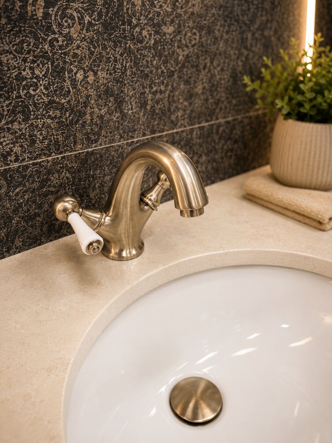 Modern brushed Nickel Warwick tap paired with the Addison vanity unit, displayed in Easy Bathrooms showroom St Albans