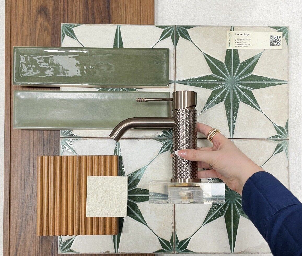 Bathroom mood board combining warm wood textures, green patterned tiles and dark brassware finishes.