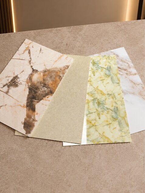 Variety of PVC bathroom wall panels in marble and stone effects