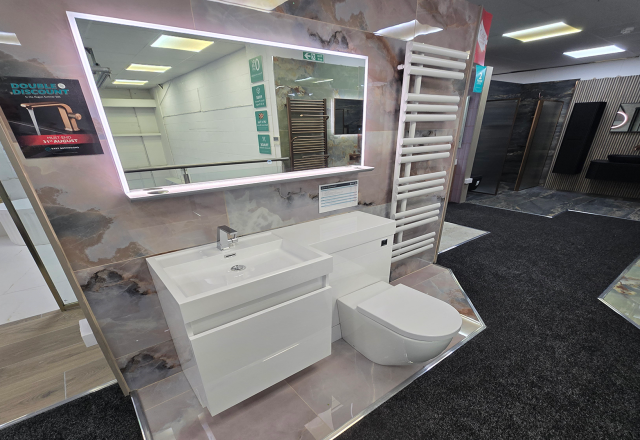 Easy Bathrooms & Tiles Showroom Newbury display stand featuring a modern bathroom suite with LED mirror and compact sink / WC