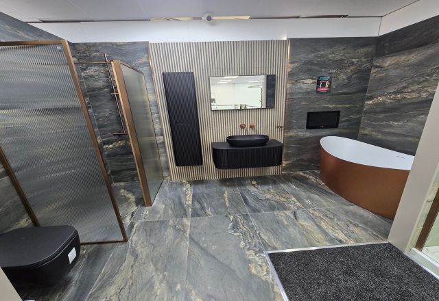 Easy Bathrooms & Tiles Showroom Newbury display stand featuring a modern bathroom suite with an onyx marble tile floor to ceiling