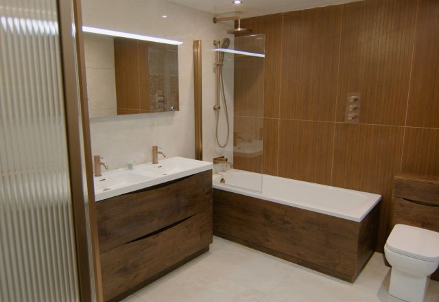 Bathroom furniture showroom display featuring fluted glass shower panel and modern bathroom furniture