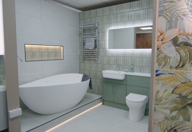 Spa like bathroom furniture display featuring bonito tropical tiles and a free standing bath