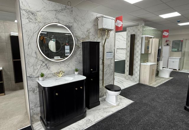 Black furniture and marble-effect tiles at Easy Bathrooms Lewisham
