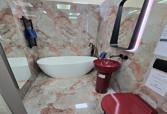 Easy Bathrooms & Tiles Showroom Newbury display stand featuring a modern bathroom suite with contemporary pink marble tiles