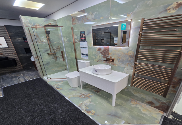 Easy Bathrooms & Tiles Showroom Newbury display stand featuring a modern bathroom suite with green marble tiles