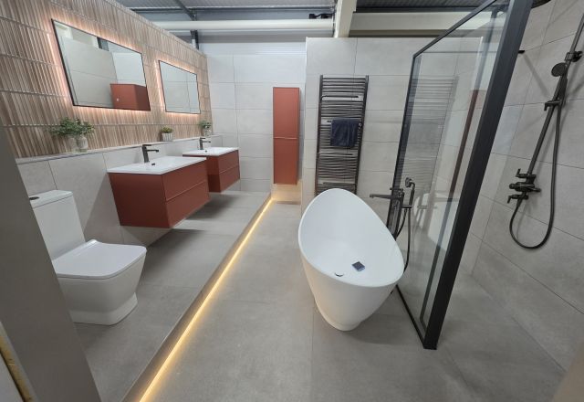 Bathroom display showing LED strip lights, LED light, floating vanity and basin, toilet, black trim shower screen