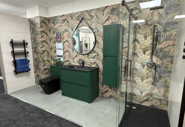 Green furniture and botanical tiles at Easy Bathrooms Lewisham
