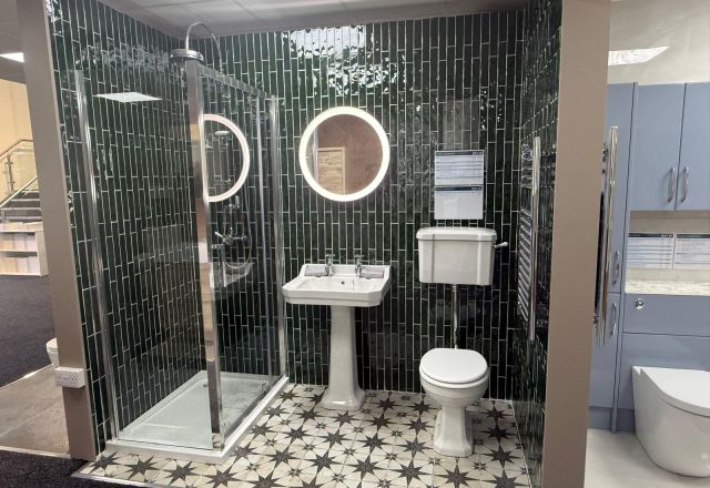 Showroom bathroom showroom with boho chic floor tiles, vertical metro tiles, traditional bathroom furniture and an LED mirror
