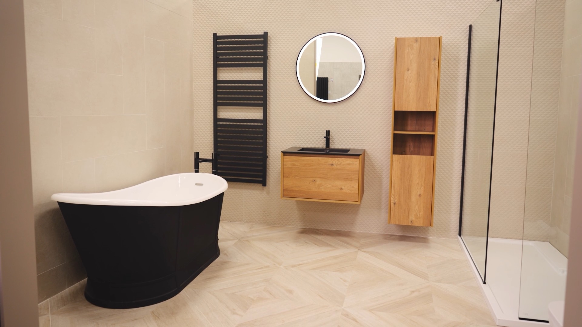 Bathroom showroom with black towel rail and vanity unit