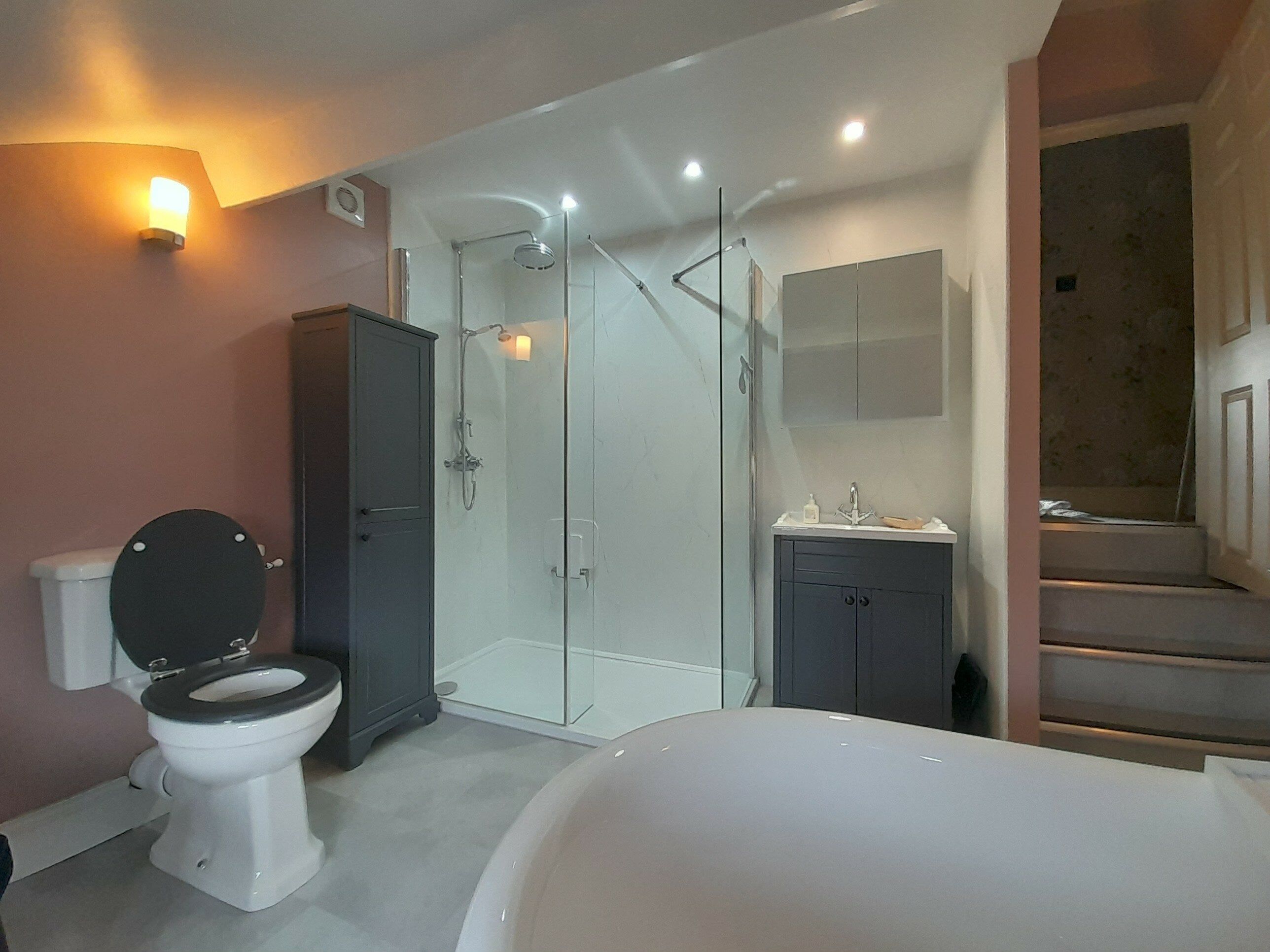 Completed traditional bathroom with a freestanding bath, enclosed shower and WC in a Grantham customer’s home.