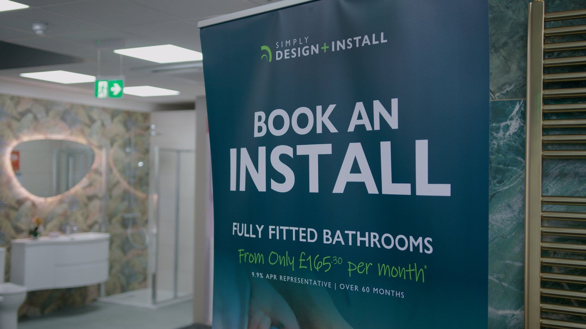 Bathroom showroom display featuring Installation offer banner at Easy Bathrooms Newcastle Airport