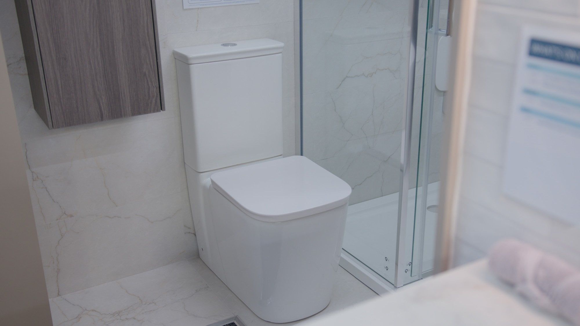 Showroom bathroom furniture display featuring modern white units
