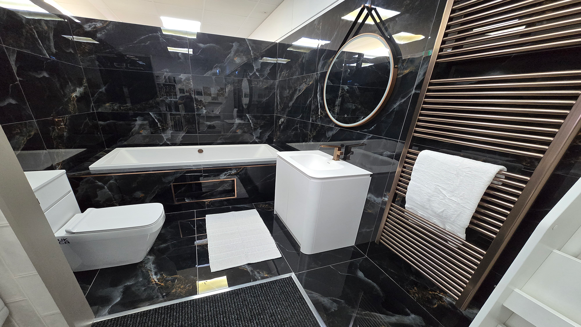 Easy Bathrooms & Tiles Showroom Newbury display stand featuring a modern bathroom suite in black tones