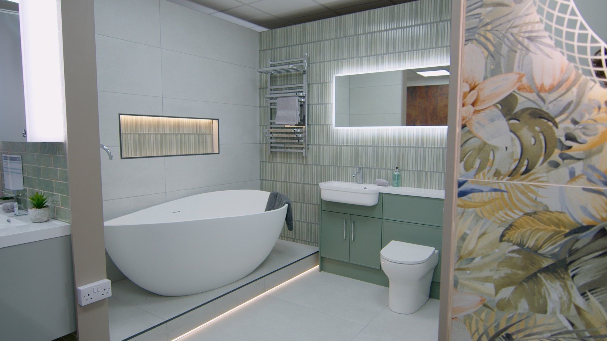 Spa like bathroom furniture display featuring bonito tropical tiles and a free standing bath