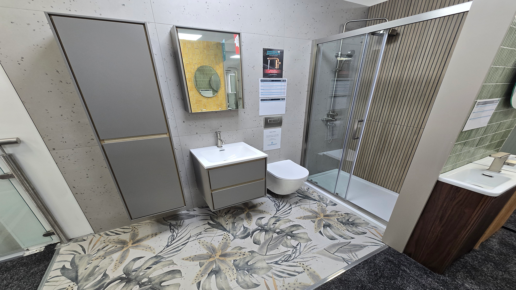 Easy Bathrooms & Tiles Showroom Newbury display stand featuring a modern bathroom suite with botanical floor tiles