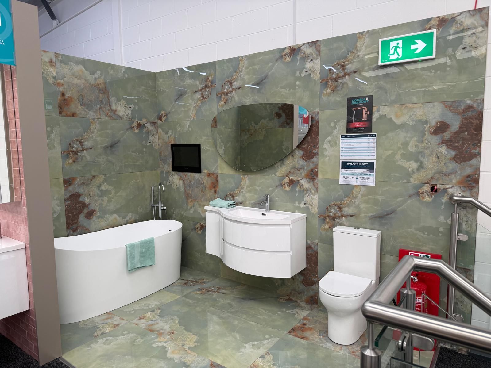 Green marble-effect bathroom display at Easy Bathrooms Lewisham