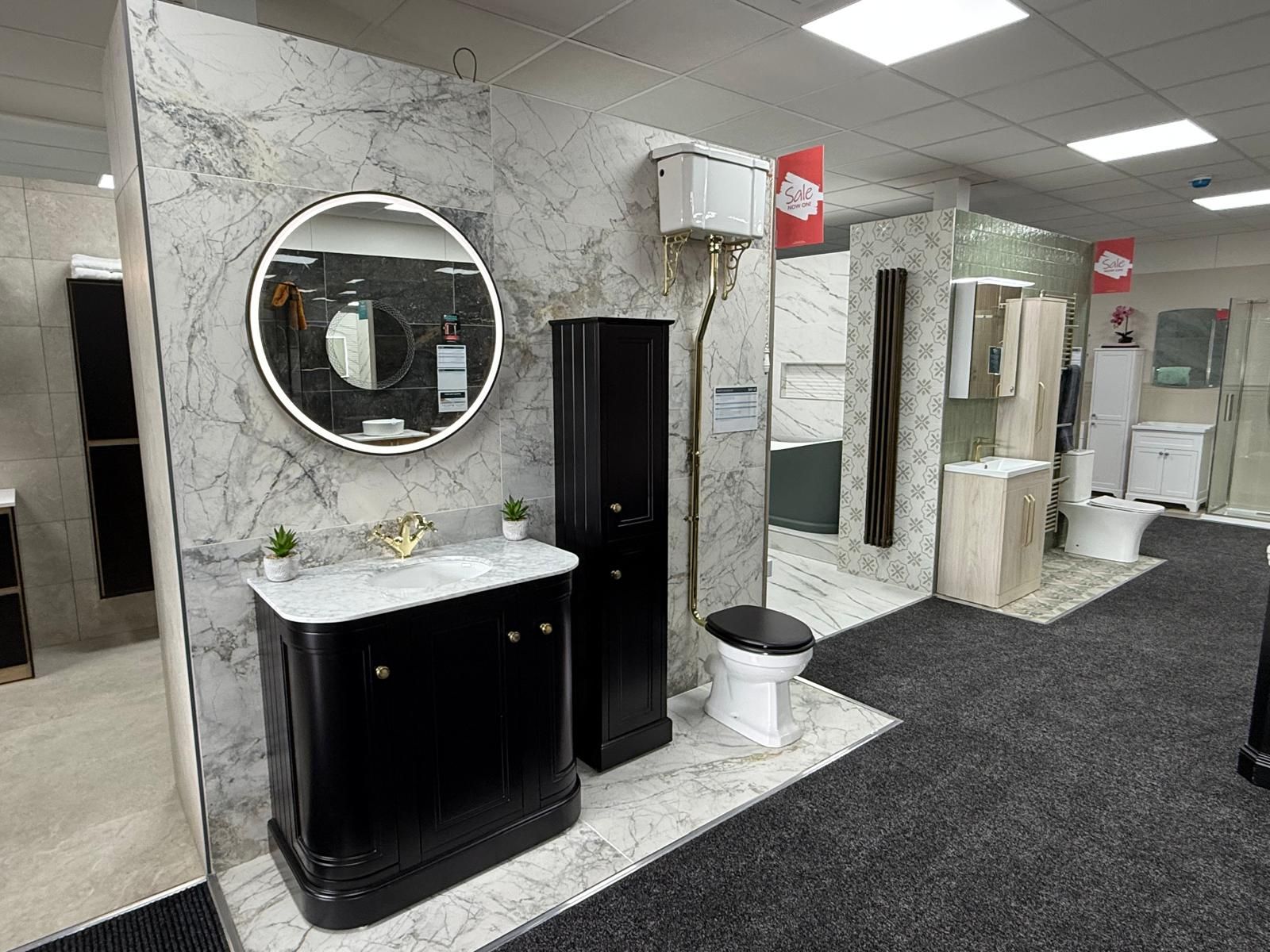 Black furniture and marble-effect tiles at Easy Bathrooms Lewisham