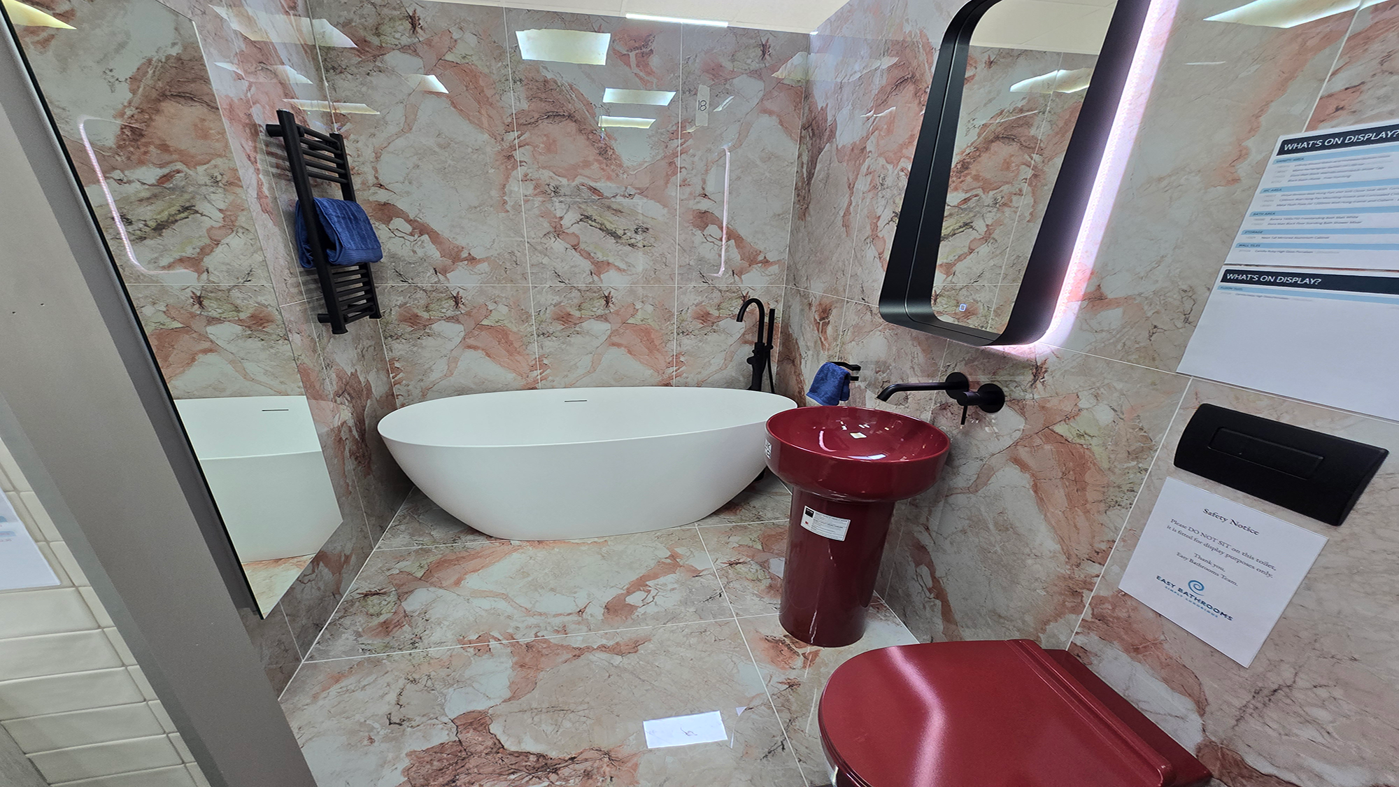 Easy Bathrooms & Tiles Showroom Newbury display stand featuring a modern bathroom suite with contemporary pink marble tiles