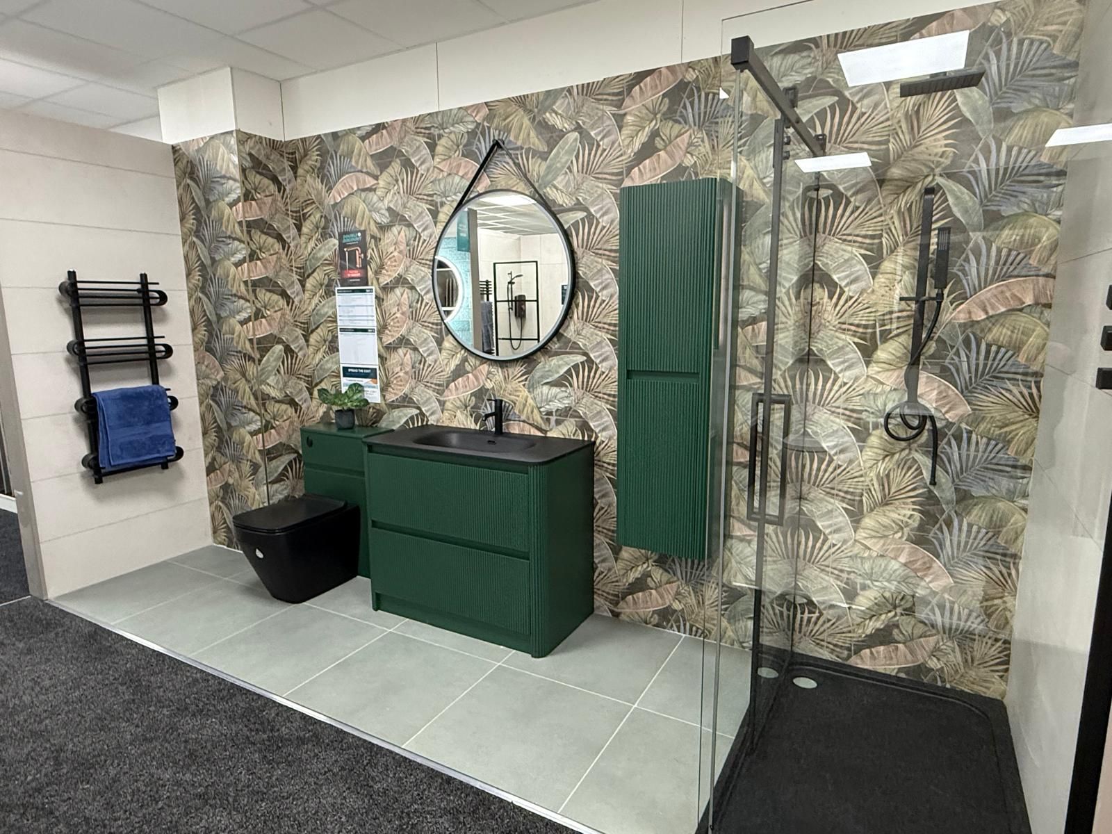 Green furniture and botanical tiles at Easy Bathrooms Lewisham